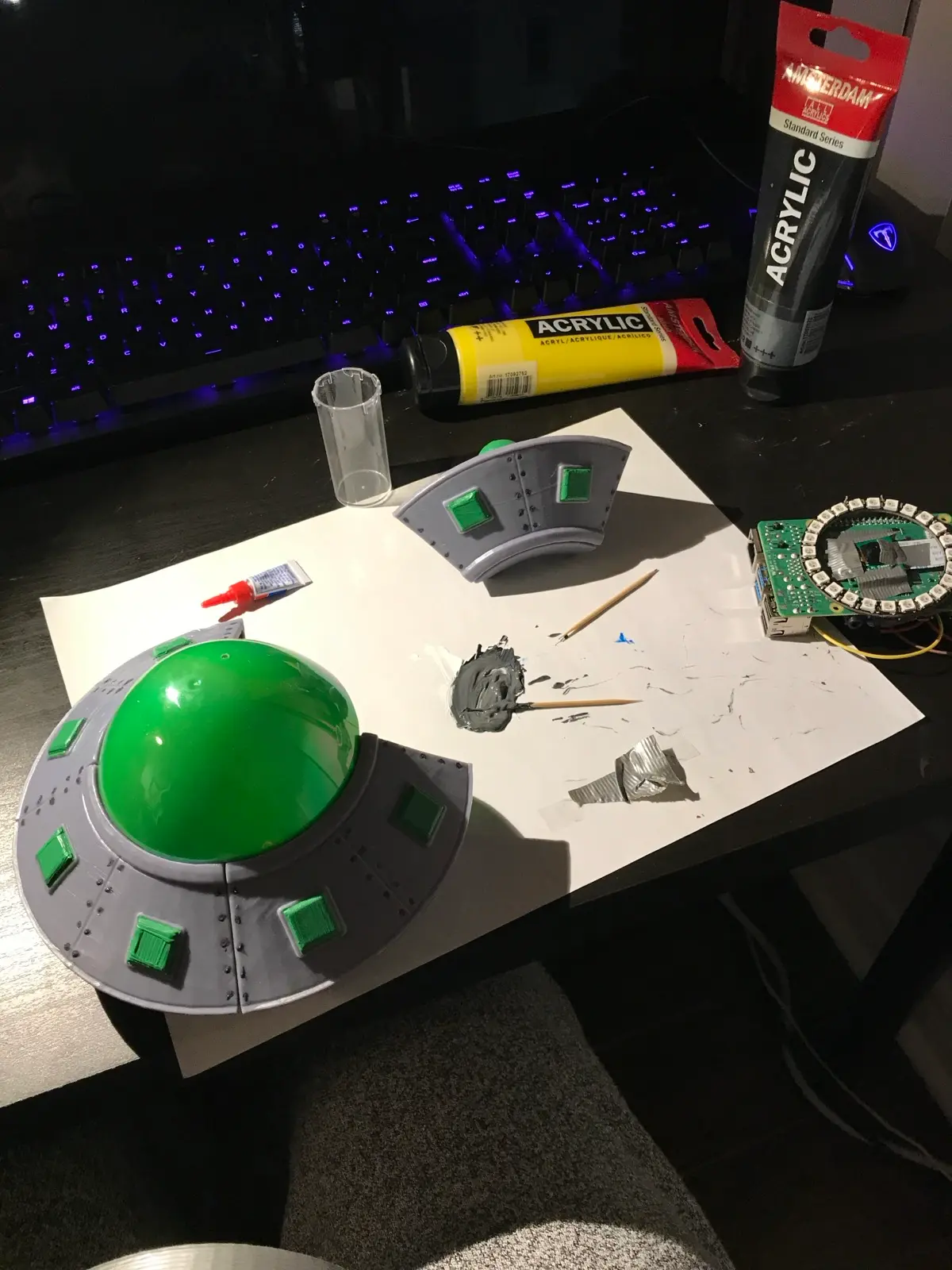 Painting session: acrylics, saucer parts, and the electronics standing by